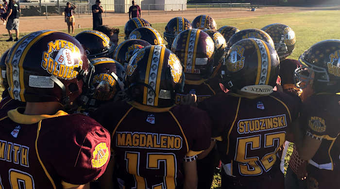 Mesa Soldiers huddling.